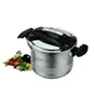A stainless steel pressure cooker with black handles and lid, placed next to a small pile of vegetables. Náhled obrázku produktu