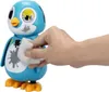 A hand is wiping a toy penguin with a cloth. Náhľad obrázku produktu