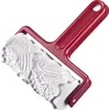 A red and white rolling pin with an embossed pattern. Produktbild-Vorschau