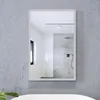 A bathroom mirror mounted on a concrete wall, reflecting a shower area. Anteprima dell’immagine prodotto