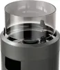 Close-up of the top of a grey gas heater with a clear plastic wind guard. Produktbild-Vorschau