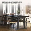 A modern dining set with black chairs and a black table in a bright room. Voir les images du produit