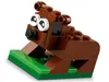 A close-up shot of a LEGO animal figure made of brown and green bricks, with white eyes and a black nose. Produktbild-Vorschau