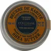 A top-down view of a round metal tin of L'Occitane Pure Shea Butter. Voir les images du produit