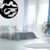 A bedroom scene with a bed, curtains, and a plant. A close-up inset shows the product. Produktbild-Vorschau