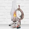 A vintage-style oil lamp with a mirror attachment, set against a white brick wall. Podgląd zdjęcia produktu