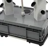 A close-up view of a hydroponic growing system, showing the base and part of the vertical towers. Podgląd zdjęcia produktu