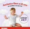 A smiling baby sitting on a fluffy surface with clouds in the background, promoting Huggies diapers. Podgląd zdjęcia produktu