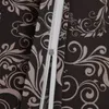 A close-up view of a zipper on a dark fabric with a floral pattern. Produktbild-Vorschau