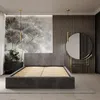 A bedroom scene featuring a bed, nightstand, and vanity with a mirror. Produktbild-Vorschau