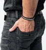 A man's hand with a bracelet in his pocket. Anteprima dell’immagine prodotto