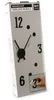 The image shows the packaging of a DIY wall clock kit. The box is mostly gray with black text and graphics depicting the clock. Náhled obrázku produktu
