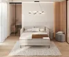 A modern bedroom with a bed, bedside table, and a large window. Produktbild-Vorschau