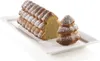 A loaf cake and a small tree-shaped cake dusted with powdered sugar on a white rectangular plate. Produktbild-Vorschau