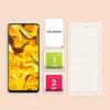 A smartphone screen protector kit laid out with a smartphone, a dust absorber, and wet and dry cleaning wipes. Produktbild-Vorschau