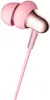 A pair of pink in-ear headphones with rose gold accents. Produktbild-Vorschau