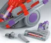A close-up of a toy vacuum cleaner with its attachments. Produktbild-Vorschau
