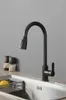 A black kitchen faucet is shown in a kitchen sink. Produktbild-Vorschau