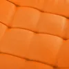 A close-up view of orange fabric with a quilted or padded texture. Produktbild-Vorschau
