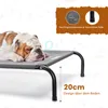 A bulldog sleeps on a raised dog bed. The image includes marketing text and diagrams. Produktbild-Vorschau