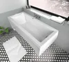 A modern white bathtub in a bathroom setting with patterned tiles. Produktbild-Vorschau