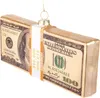 A close-up of a glass ornament shaped like a stack of US dollar bills. Podgląd zdjęcia produktu
