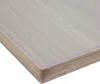 A close-up view of a corner of a transparent or matte PVC table protector, showing its layered construction and wood-grain pattern. Produktbild-Vorschau