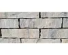 A close-up, straight-on view of a wall constructed from stacked stone blocks. Produktbild-Vorschau