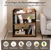 A three-tier bookshelf with various items on its shelves, set against a light gray and white background, with a sofa partially visible on the right. Below the bookshelf, there are circular icons representing books, decorations, photos, a clock, baskets, an Produktbild-Vorschau