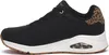 A side view of a black Skechers sneaker with leopard print accents on the heel. Anteprima dell’immagine prodotto