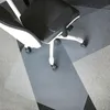 An office chair is placed on a transparent floor mat on a carpeted floor. Náhled obrázku produktu