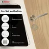 A door handle set with its included components displayed on a wooden door. Produktbild-Vorschau