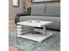A modern white coffee table is placed in a living room setting, in front of a gray sofa, on a patterned rug. Náhľad obrázku produktu