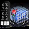 A transparent battery pack with visible battery cells, resting on a circuit board. Voir les images du produit
