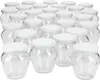 A group of empty glass jars with white lids. Produktbild-Vorschau