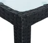 A close-up view of the corner of a black rattan table with a glass top. Produktbild-Vorschau