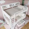 A white bunk bed with shelves and a pull-out drawer, set in a child's bedroom with pink walls and a patterned rug. Anteprima dell’immagine prodotto