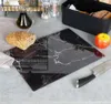 A kitchen scene with a cutting board, bread, an apple, a knife, and a bottle of olive oil. Náhľad obrázku produktu