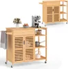 A wooden kitchen cart with wheels, drawers, and shelves, shown with some kitchen items on top and on the shelves. Podgląd zdjęcia produktu