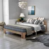A bedroom with a bed and a cowhide rug. Náhled obrázku produktu
