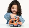 A young girl plays with a toy car. Náhľad obrázku produktu