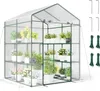 A greenhouse filled with plants on shelves. Voir les images du produit