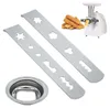 A set of cookie press discs and a meat grinder with churros. Produktbild-Vorschau