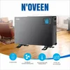 A black convector heater is shown in a living room setting, with marketing icons and text below. Podgląd zdjęcia produktu