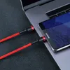 A red braided USB-C charging cable is connected to a Huawei smartphone and a laptop. Produktbild-Vorschau