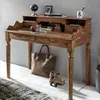 A wooden secretary desk with various items on and around it, including a tote bag and boots. Produktbild-Vorschau