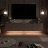 A modern living room with a wall-mounted TV and media console, featuring ambient LED lighting. Produktbild-Vorschau