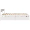 A white wooden bed frame with drawers, shown from the side against a white background. Produktbild-Vorschau