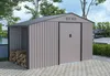 A garden shed with an attached wood storage area, set in an outdoor environment with a paved patio, trees, and a car in the background. Produktbild-Vorschau