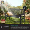 A dark gray wooden garden bench sits in an orchard with red apples on trees and in a basket nearby. Sunlight streams through the trees. Produktbild-Vorschau